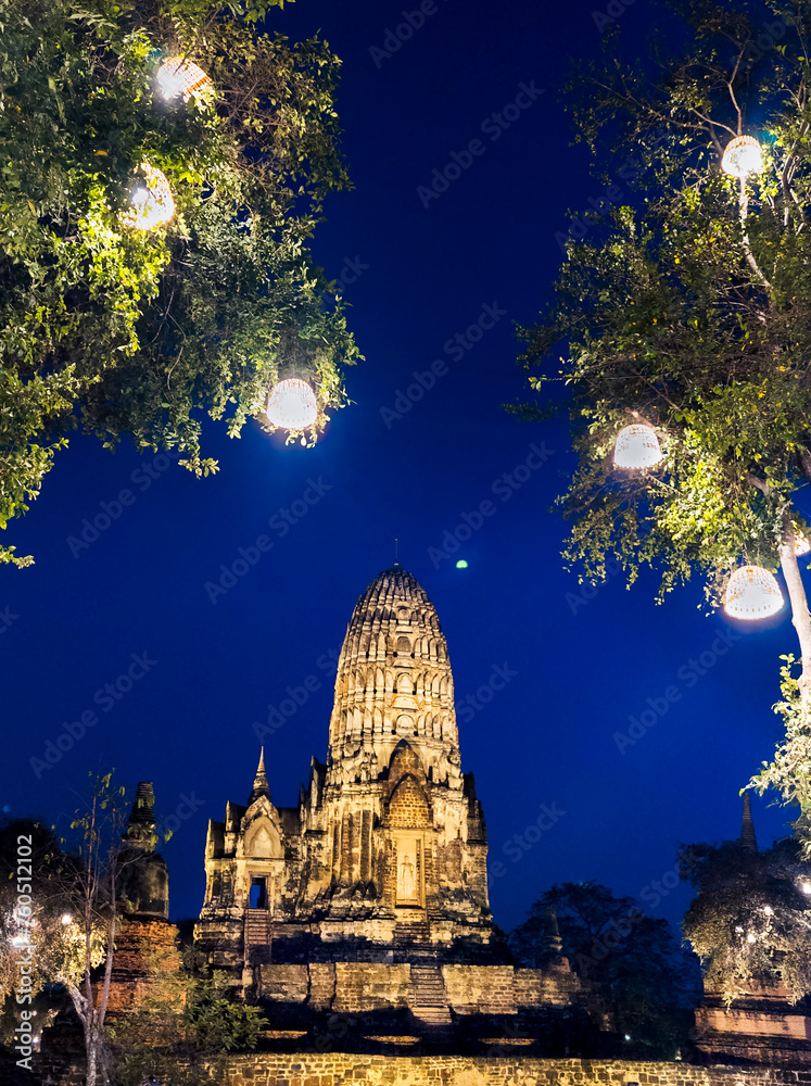 Wat Ratcha Burana,illuminated at night,next to tree lights,Ayutthaya,Thailand. Wat Ratcha Burana,illuminated at night,next to tree lights,Ayutthaya,Thailand.