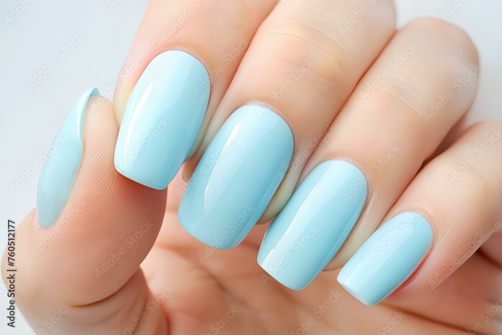 Girl's hands with a beautiful pastel blue manicure. Girl's hands with a beautiful pastel blue manicure.