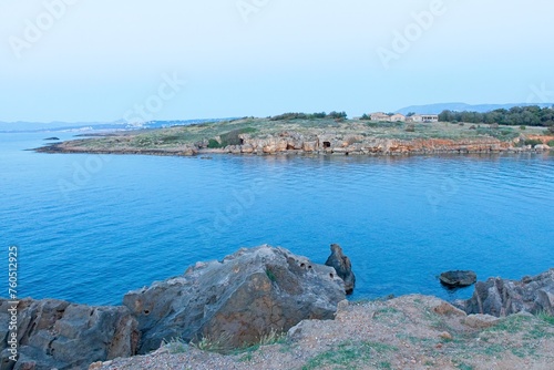 Landscape view of coastline in the evening in clear spring weather, Agioi Apostoloi, Crete, Greece. photo