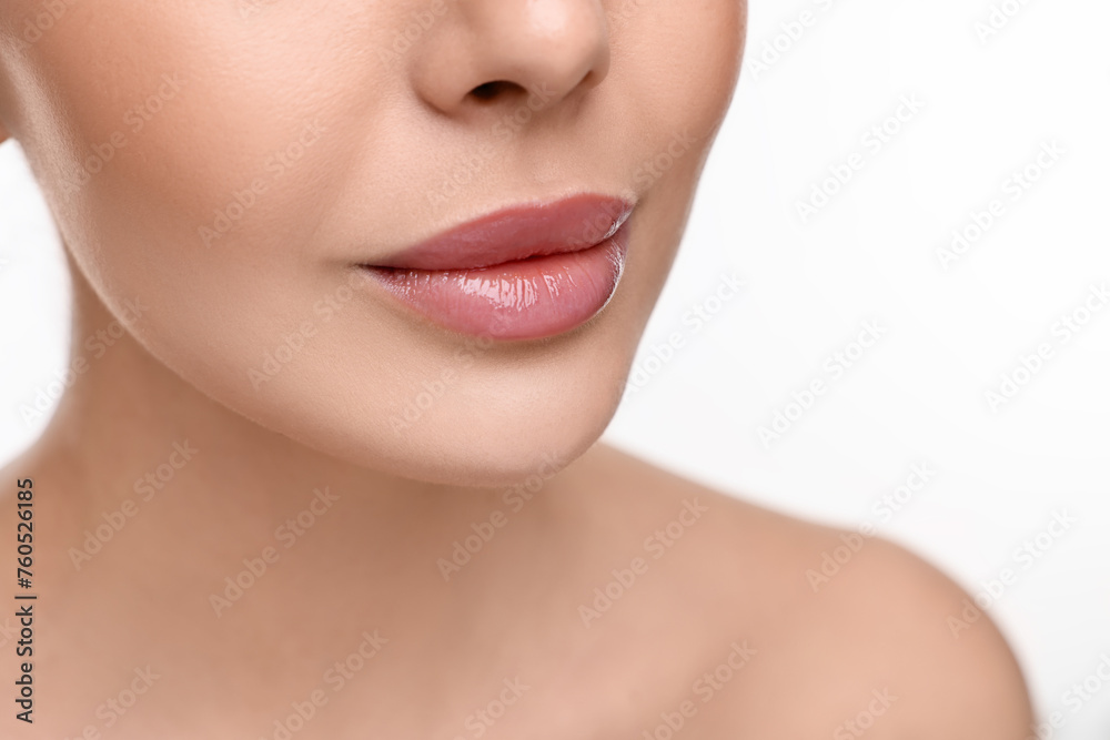 Woman with beautiful lips on white background, closeup Woman with beautiful lips on white background, closeup