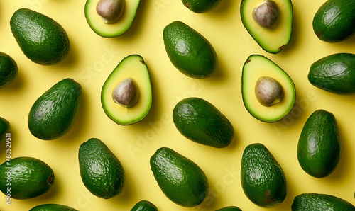 close up of avocados flat lay wallpaper, on pastel yellow background, food / kitchen background 