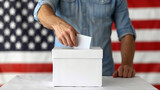 Man putting his vote into ballot box on blurred background сreated with Generative Ai