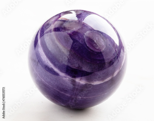 ball from natural charoite mineral on white photo
