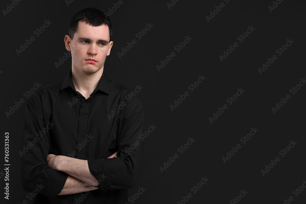 Portrait of sad man on black background, space for text Portrait of sad man on black background, space for text