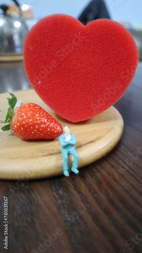 people with red heat and strawberry design for story and connotation concept