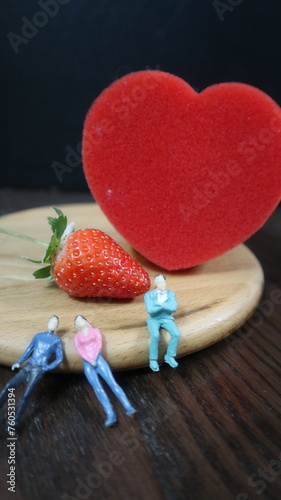 Valokuva people with red heat and strawberry design for story and connotation concept