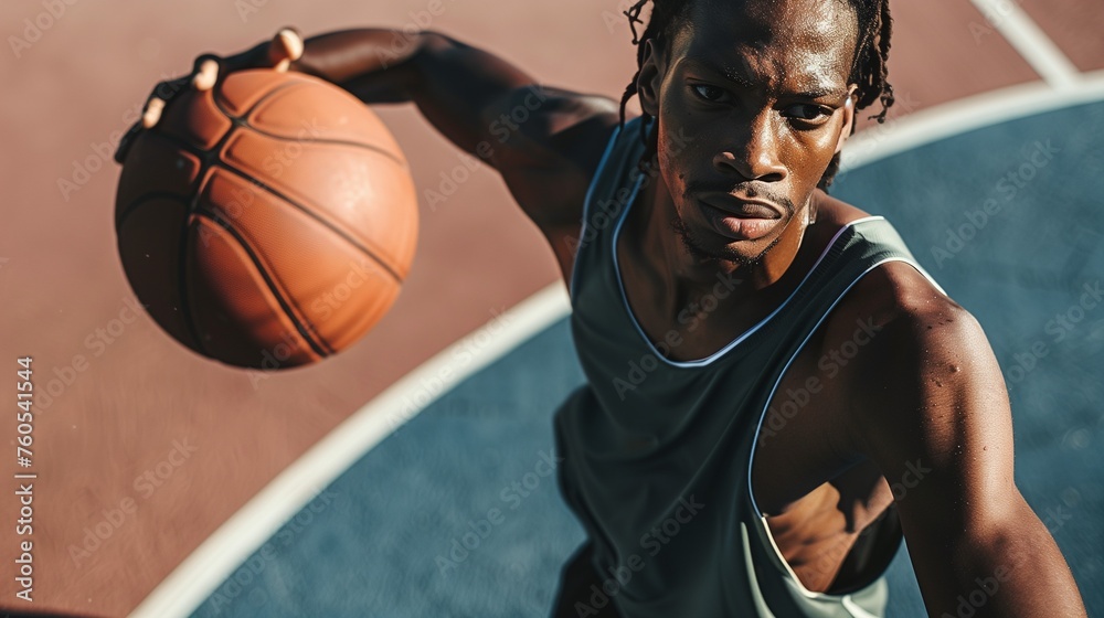 Action shot of African man playing basketball outdoors, copy space, close up