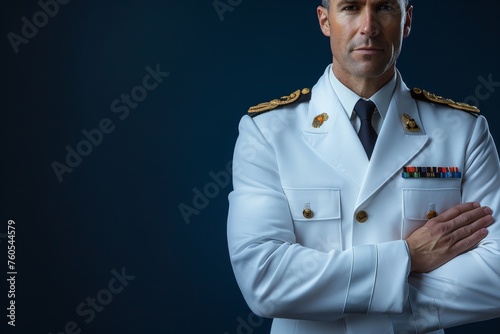Navy officer in pristine white dress uniform with decorated medals