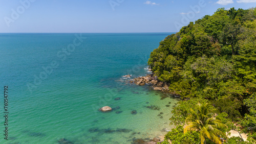 Aerial view of a turquoise lagoon with shallow ocean and small sandy tropical beach. Lam Ru national park in Khao Lak, Thailand. 