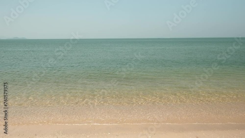 Horizon with sky and white sand tropical.
Wave sea of the on a beach sand background. 