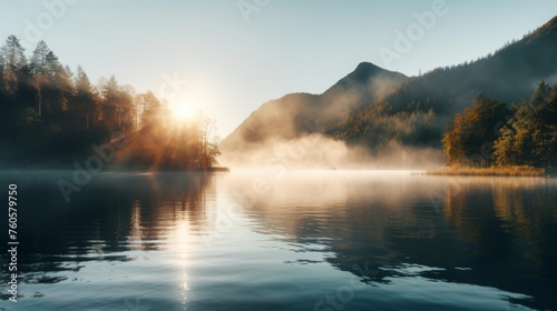 Lake in the early morning fog with sun and mountain view