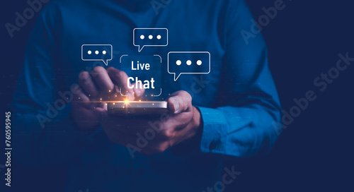 A close-up of a man's hands holding a smartphone, with Live Chat online communication and customer service technology, Chat with AI, Artificial Intelligence. Futuristic technology transformation.