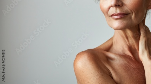 Closeup portrait of a mature woman, graceful aging with focus on her glowing skin, natural beauty. Caring for skin in menopause. Estrogens and aging skin. Advertising facial, body anti age products