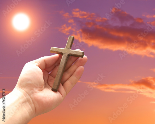 Cross in arm at sunset. Good Friday concept. 3d illustration