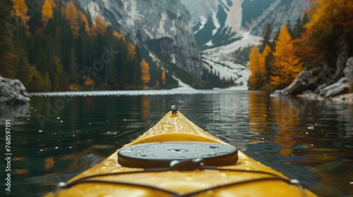 A yellow kayak floating on calm water. Suitable for outdoor and adventure concepts