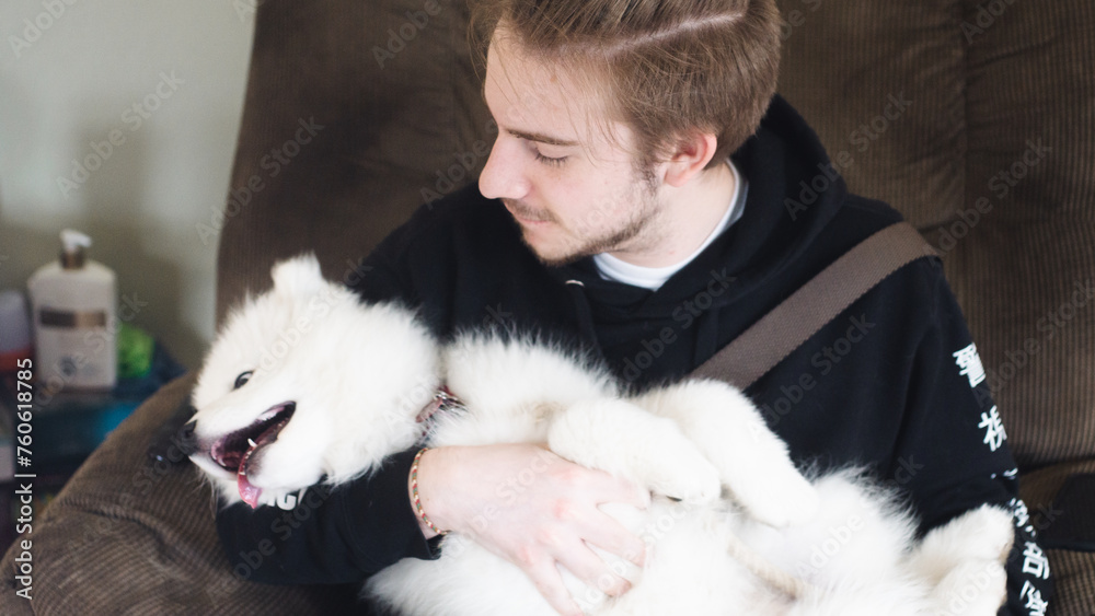 man hugging a dog inside man hugging a dog inside