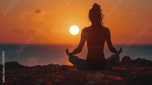 Woman Sitting in Yoga Position in Front of Sun