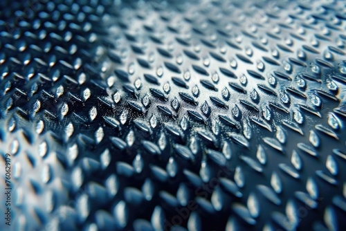 Close-up view of water droplets on metal surface, suitable for backgrounds and textures