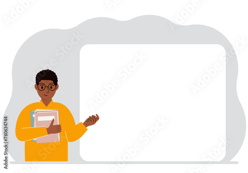 The man holds many books. Nearby is a large white poster for your text.