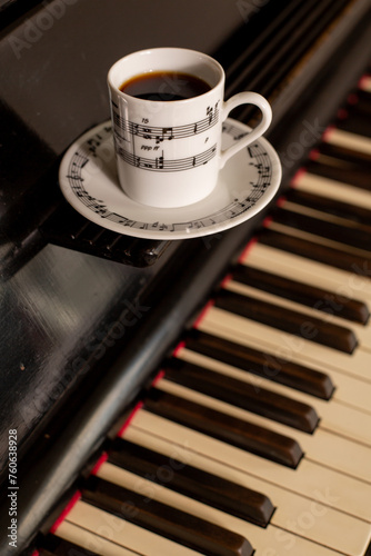 The white coffee cup put on vintage piano key