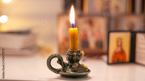 Obraz na plátne church candle close up bokeh, prayer and lent concept
