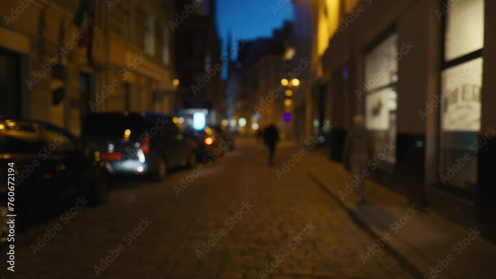 Blurry image of city street at night with people and car lights Blurry image of city street at night with people and car lights