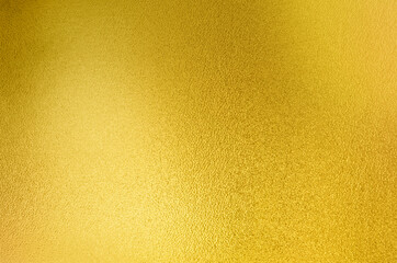 Luxury gold gradient light shiny glitter texture background. Golden shiny foil gradient metallic metal polished sheet with gloss light reflection, vibrant golden metal wall wallpaper