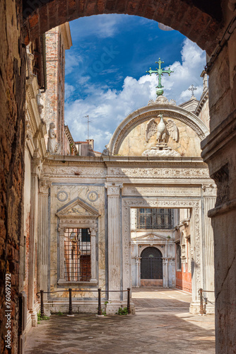 Campo San Giovanni (St John Square) in Venice, with renaissance marble screen erected in 1481, seen from narrow lane