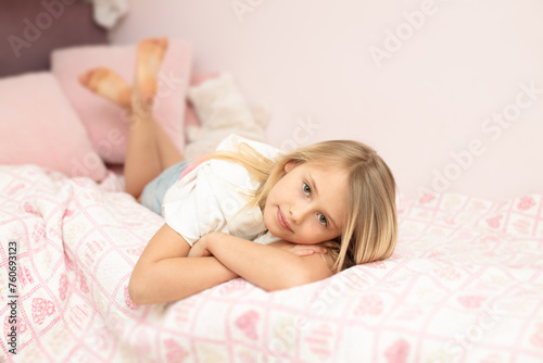 young girl lying on the bed