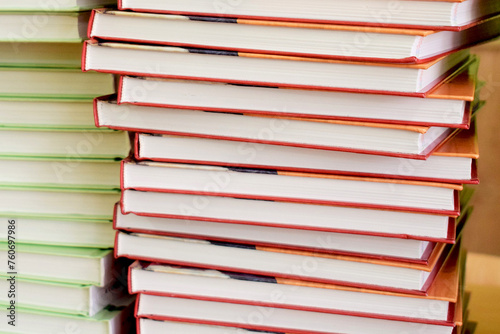Load of knowledge. A large pile of new books in hardcover