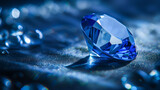 Macro photography of blue sapphire on the blurred background with blares. Product shot of the blue cut gemstone surrounded by blurred sparkles on a dark background