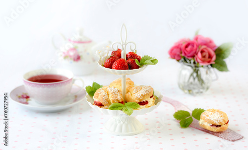 cake with strawberries and cream on a table