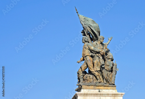 Bronze monument of victory on Piazza Venezia (Venice Square) in Rome with blue sky