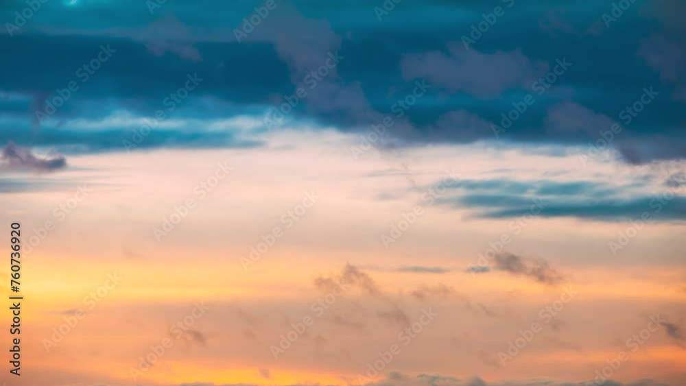 Natural Transition To Evening Colorful Sundown. Sunset Sky Background Backdrop. Bright Dramatic Sky With Colourful Clouds. Sky In Blue Yellow Orange Pink Colors. 4K 60FPS Natural Transition To Evening Colorful Sundown. Sunset Sky Background Backdrop. Bright Dramatic Sky With Colourful Clouds. Sky In Blue Yellow Orange Pink Colors. 4K 60FPS