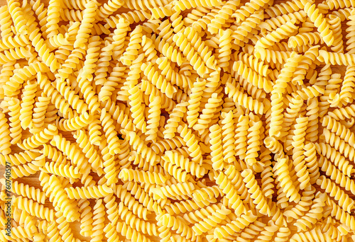 Italian pasta fusilli background. Top view, close up. Close up view at the fusilli pasta Macaroni background or texture
