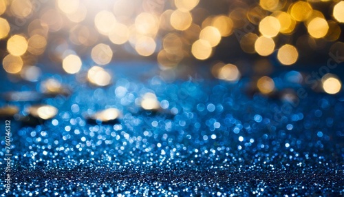 blue and gold glittering bokeh background for new year 2024 and holidays celebration
