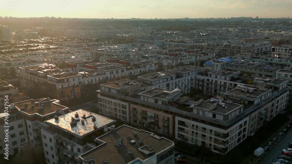 Aerial View of a Modern Urban Housing Estate, Low-Rise Apartments During Golden Hour. Aerial View of a Modern Urban Housing Estate, Low-Rise Apartments During Golden Hour.