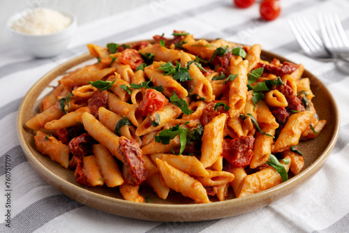 Homemade One-Pot Creamy Tuscan Pasta on a Plate, side view.