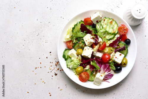 Fresh vegetable salad with feta cheese. Top view with copy space.