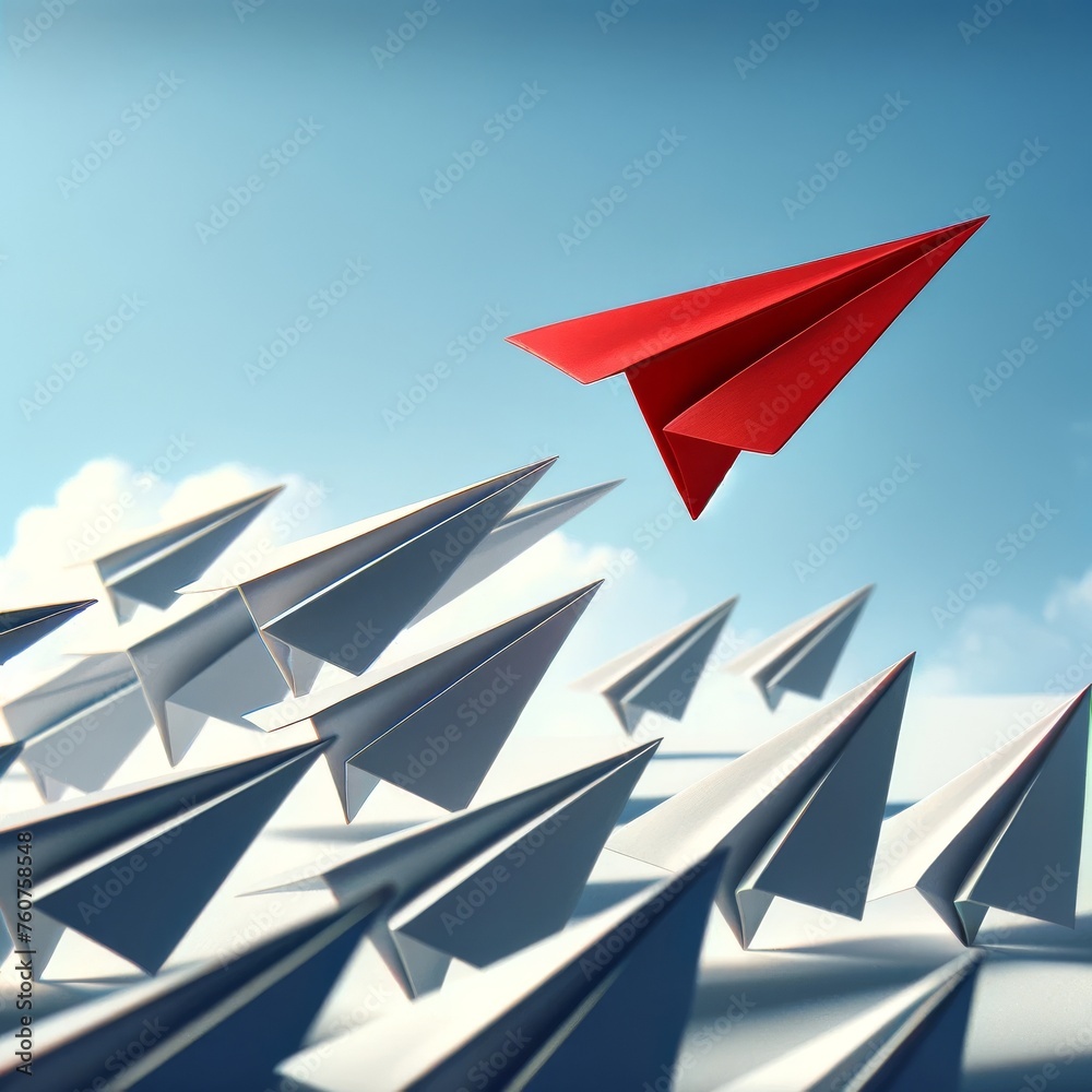 A red paper airplane is flying through a group of white paper airplanes A red paper airplane is flying through a group of white paper airplanes