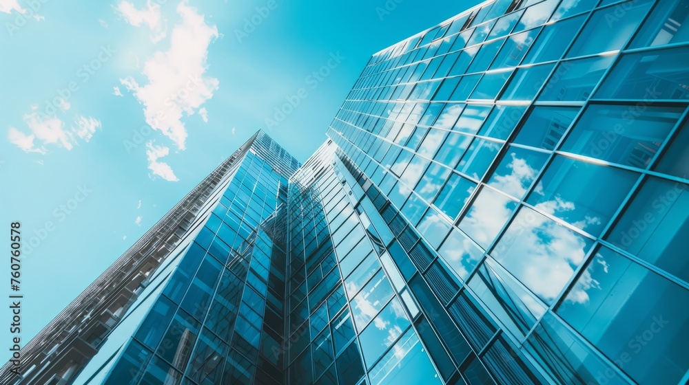 The glass Windows of modern office buildings reflect the blue sky and clouds, symbolizing the transparency of business practices.