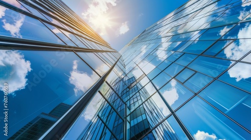 The glass Windows of modern office buildings reflect the blue sky and clouds, symbolizing the transparency of business practices.