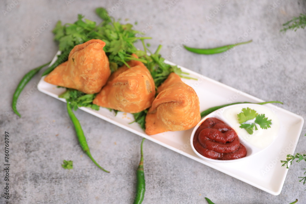 Samosa Indian famous street food snack closeup with selective focus and blur Samosa Indian famous street food snack closeup with selective focus and blur