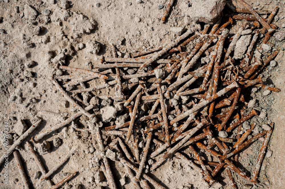Used nails waste at construction site which rusted and covered in cement concrete. Used nails waste at construction site which rusted and covered in cement concrete.
