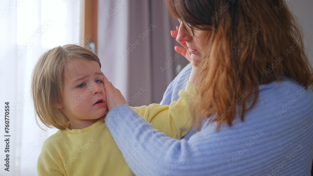 Concerned Worried Mother Checking Her Daughter Fever Body Temperature by Touching Forhead with Hand Palm Concerned Worried Mother Checking Her Daughter Fever Body Temperature by Touching Forhead with Hand Palm