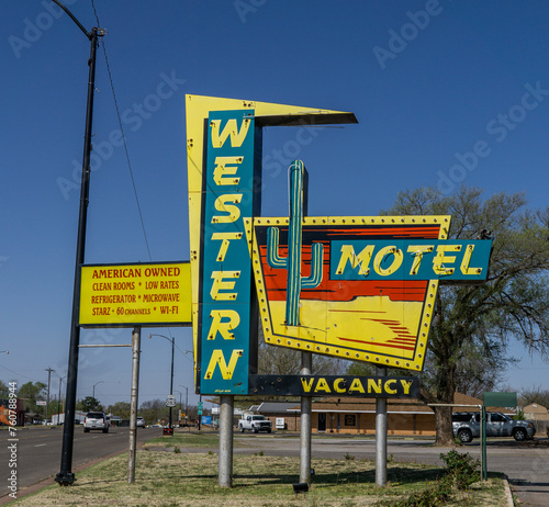 flashy motel sign on side of road