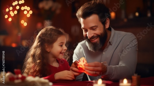 Father smiling and gifting Easter egg his daughter 