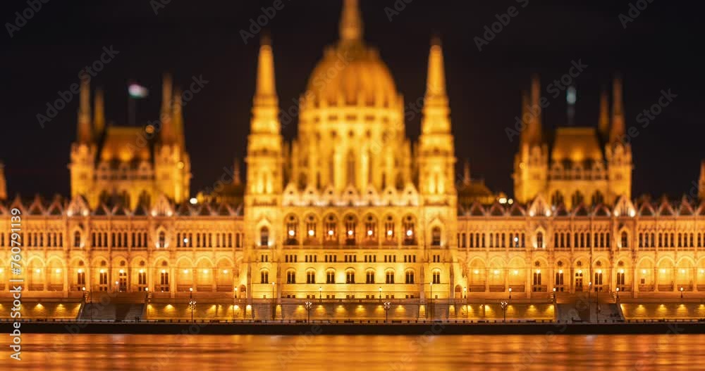 Budapest, Hungary: February 13, 2024: Parliament building at night. Time-lapse, Zoom-out transition. Budapest, Hungary: February 13, 2024: Parliament building at night. Time-lapse, Zoom-out transition.