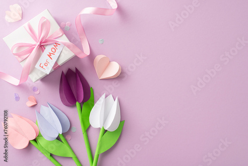 Fototapeta Naklejka Na Ścianę i Meble -  Homemade gift for mom: Top-view photo of crafted paper tulips, gift in ribbon with 