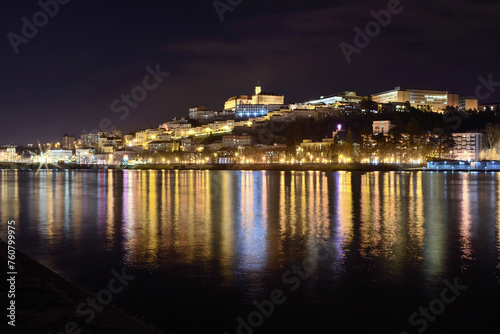 View of Coimbra at night over the mondego river